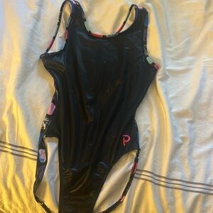 Plum, adult, medium, black, multi colored gymnastics leotard.